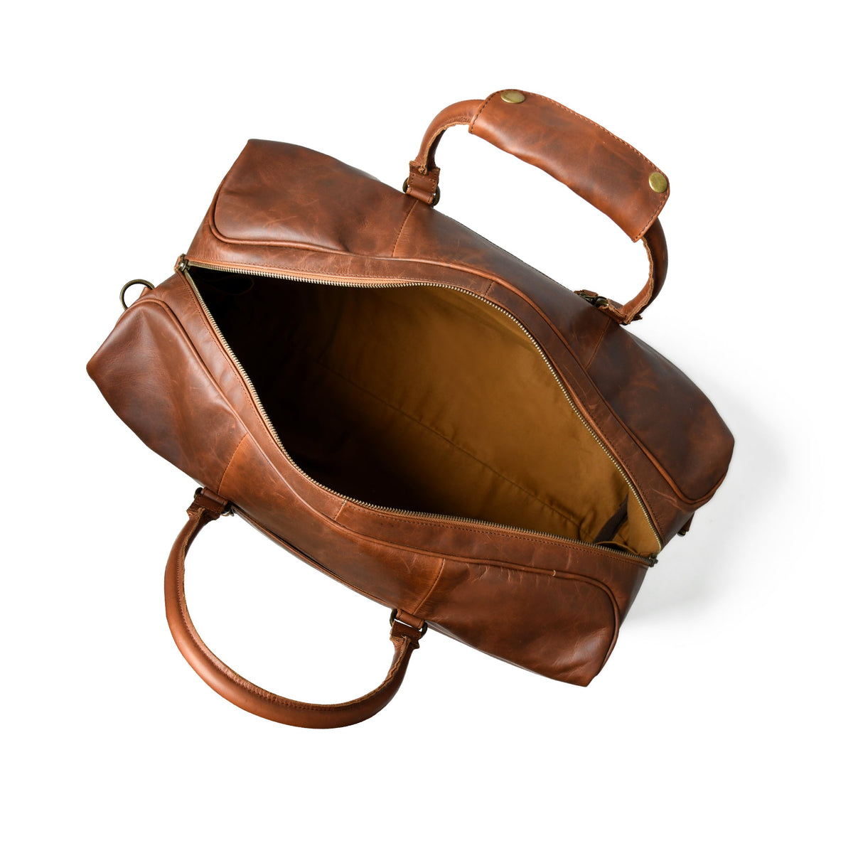Open brown Cuiravo Armand waxed leather weekender duffel showing tan interior lining and leather handles