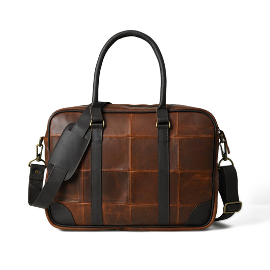 Front view of waxed leather laptop briefcase showing pockets, closure, and hardware