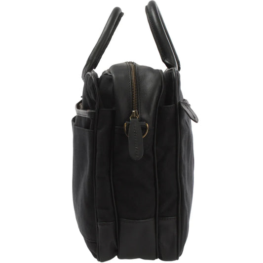 Black canvas and cowhide briefcase side view showing gusseted depth, leather trim, and brass-tone zipper