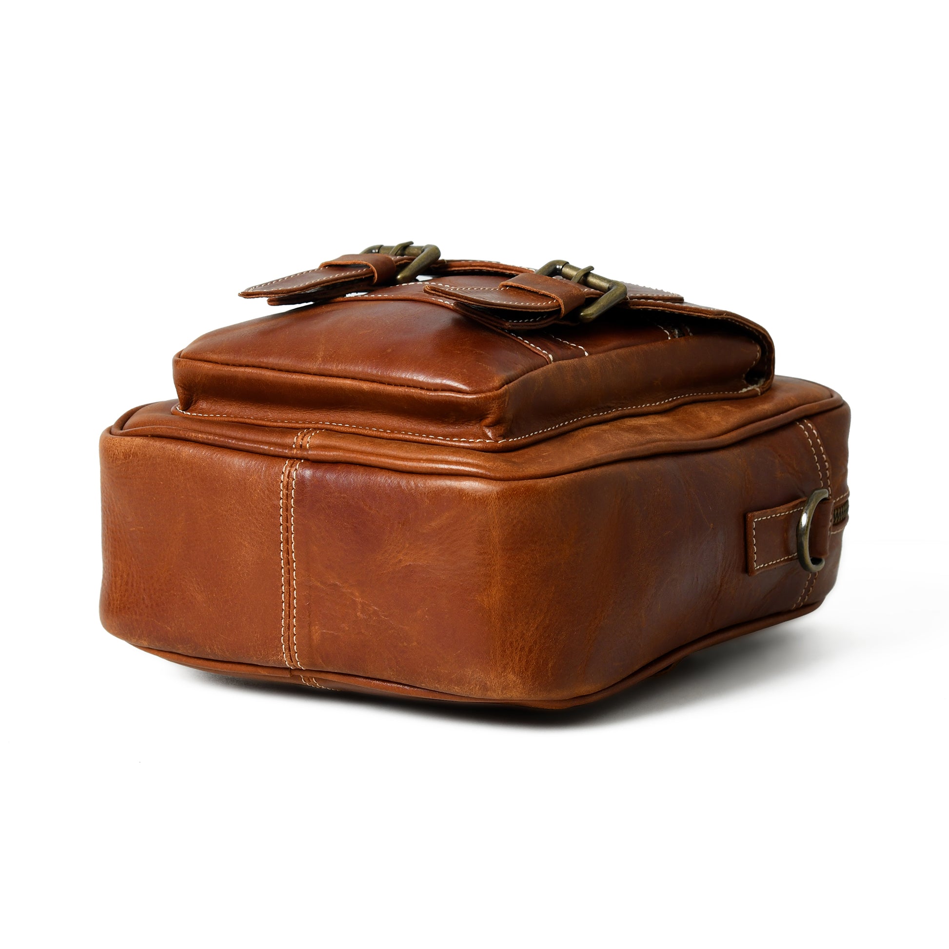 Bottom view of waxed buffalo leather crossbody bag showing the reinforced base and edge stitching
