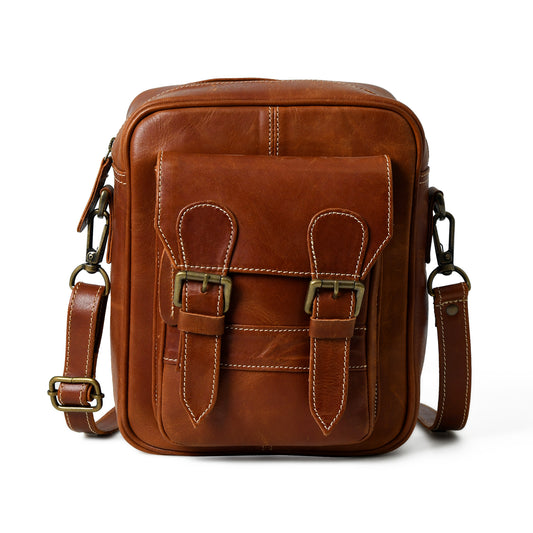 Front view of waxed buffalo leather crossbody bag showing pockets, closure, and hardware