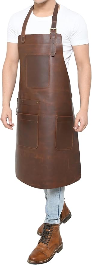Full-length front view of brown leather work apron with chest pocket, two lower pockets, and brass hardware