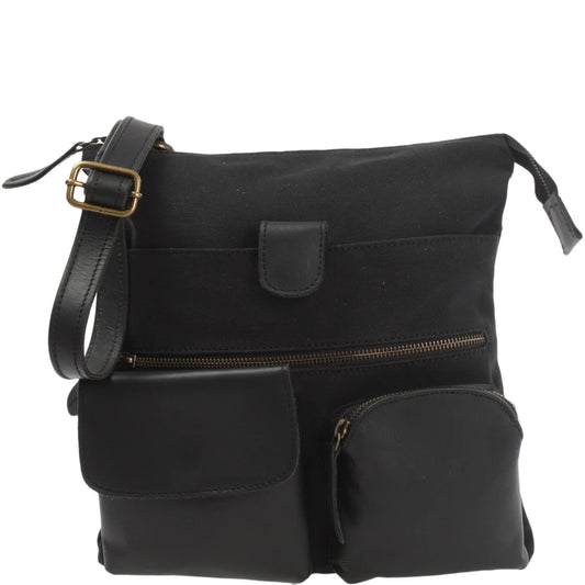 Black Arden canvas and cowhide crossbody bag, front view with leather pockets and adjustable buckle strap