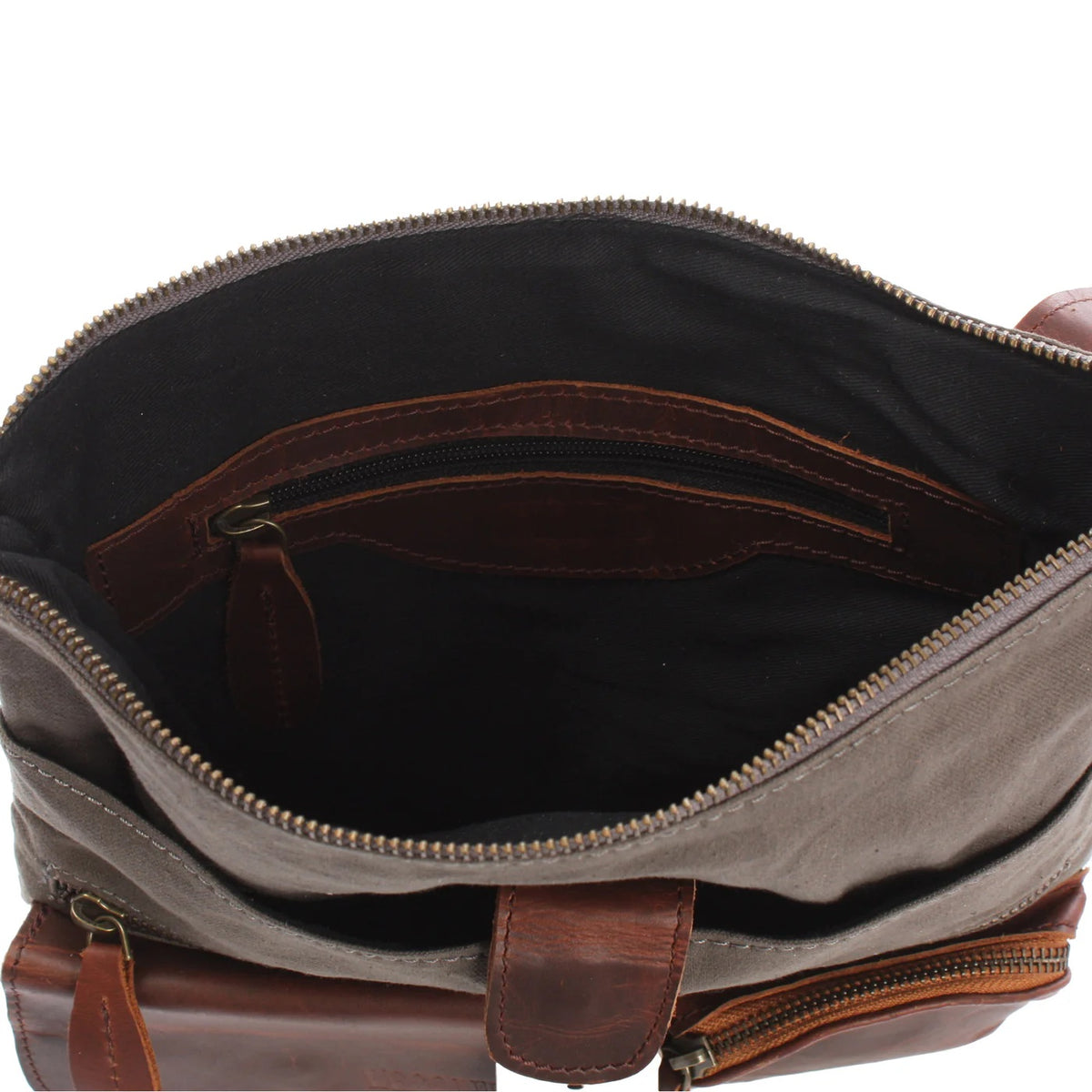 Open gray Arden crossbody bag showing dark lining, zip main compartment, and interior zipper pocket