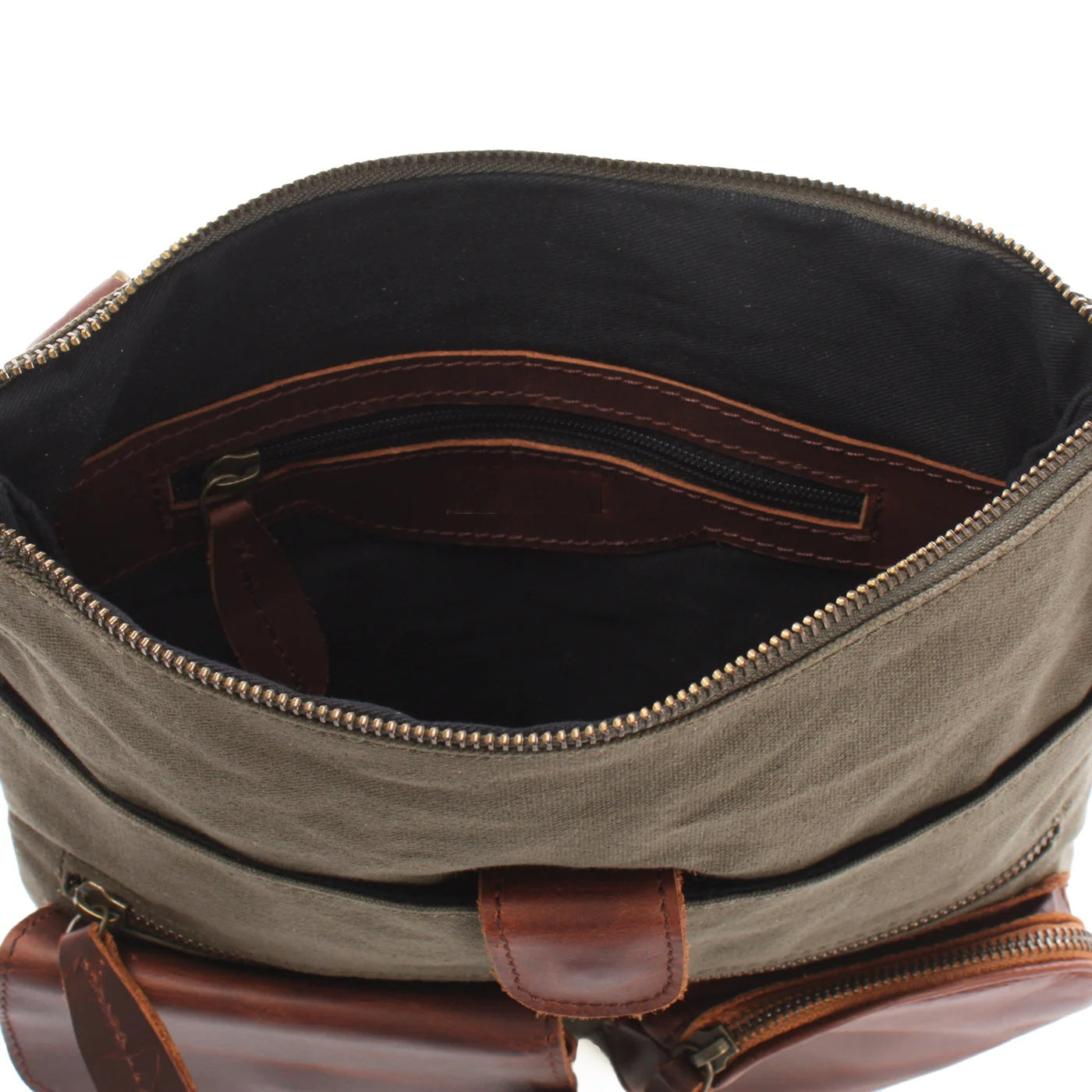 Open olive green Arden crossbody bag showing dark lining, zip main compartment, and interior zipper pocket