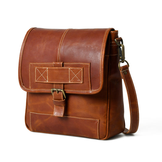 Waxed buffalo leather crossbody bag in an angled front view with handles and hardware