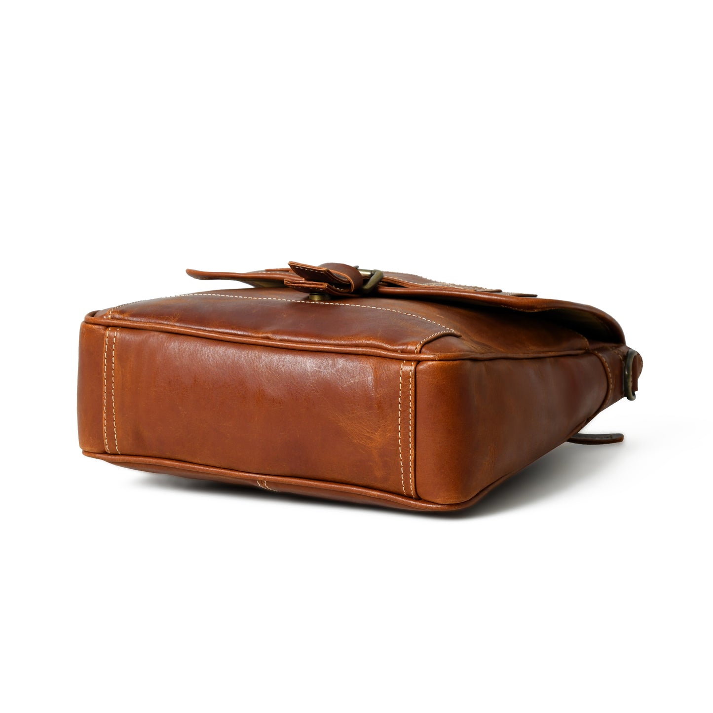 Bottom view of waxed buffalo leather crossbody bag showing the reinforced base and edge stitching