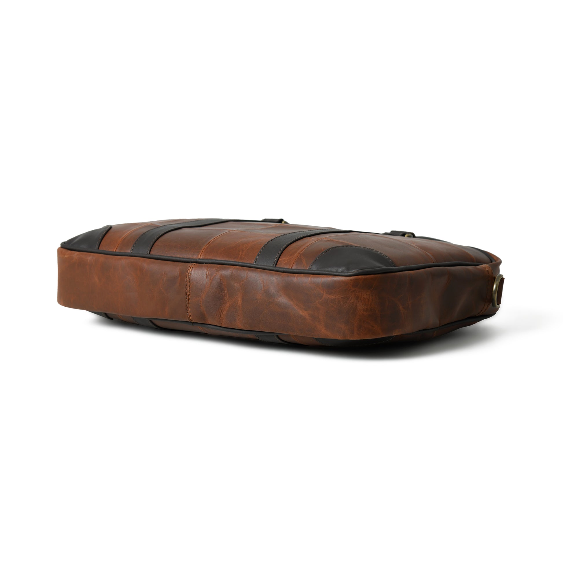 Bottom view of waxed leather laptop briefcase showing the reinforced base and edge stitching