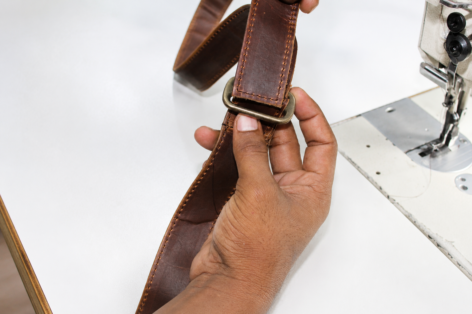 Cuiravo bag being inspected for stitching, hardware, finish, and personalization