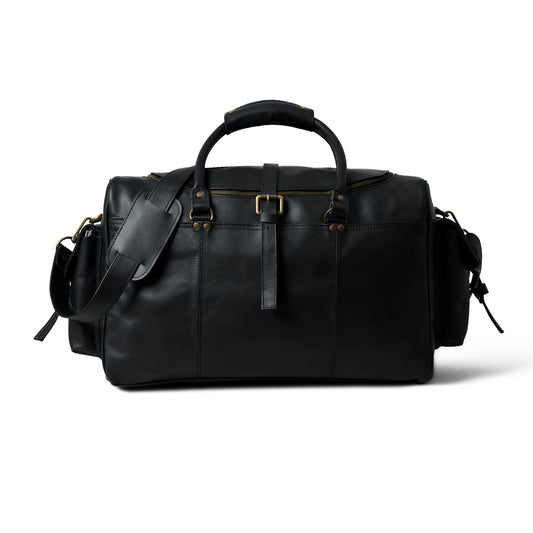 A black leather duffel bag with gold-tone hardware, dual top handles, and a detachable shoulder strap, shown from a front angle on a white background.