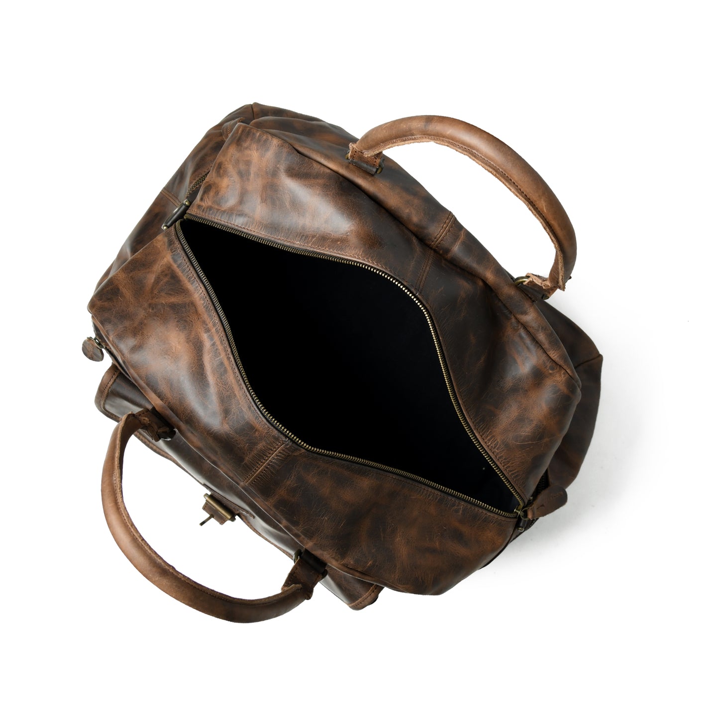 Waxed Cow Leather weekender duffel, close product view showing stitching and material texture. A distressed brown leather duffel bag shown from an overhead angle with its main compartment open, revealing a dark interior, on a clean white background.