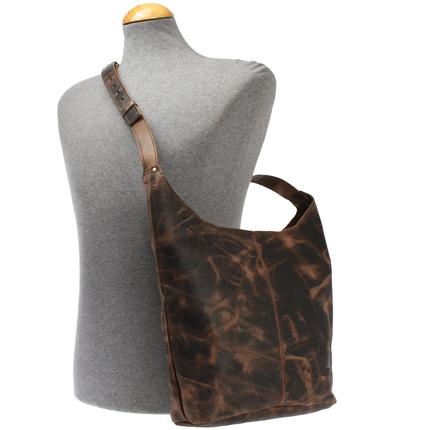 Mud brown Elaine leather shoulder bag worn on a mannequin, showing size and adjustable strap