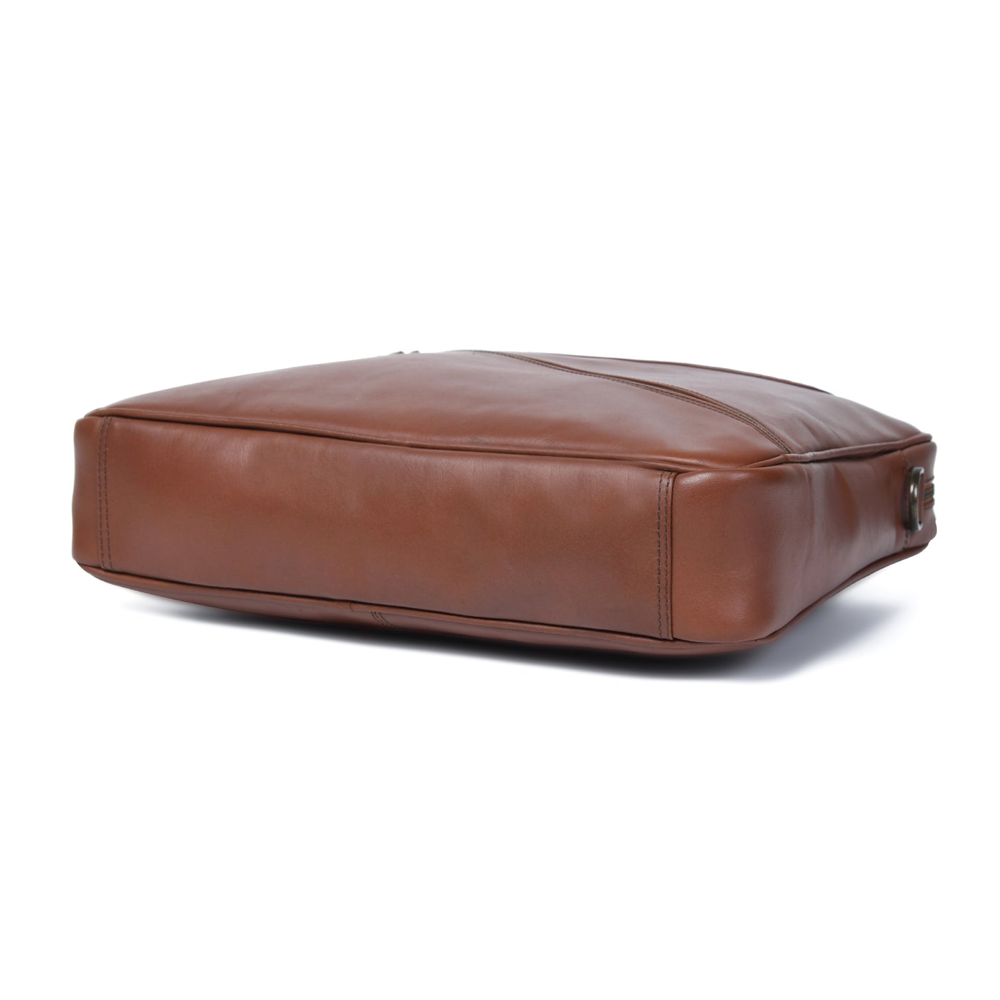 Cuiravo Lucien briefcase base showing a slim profile, smooth cognac leather, piping, and reinforced corners