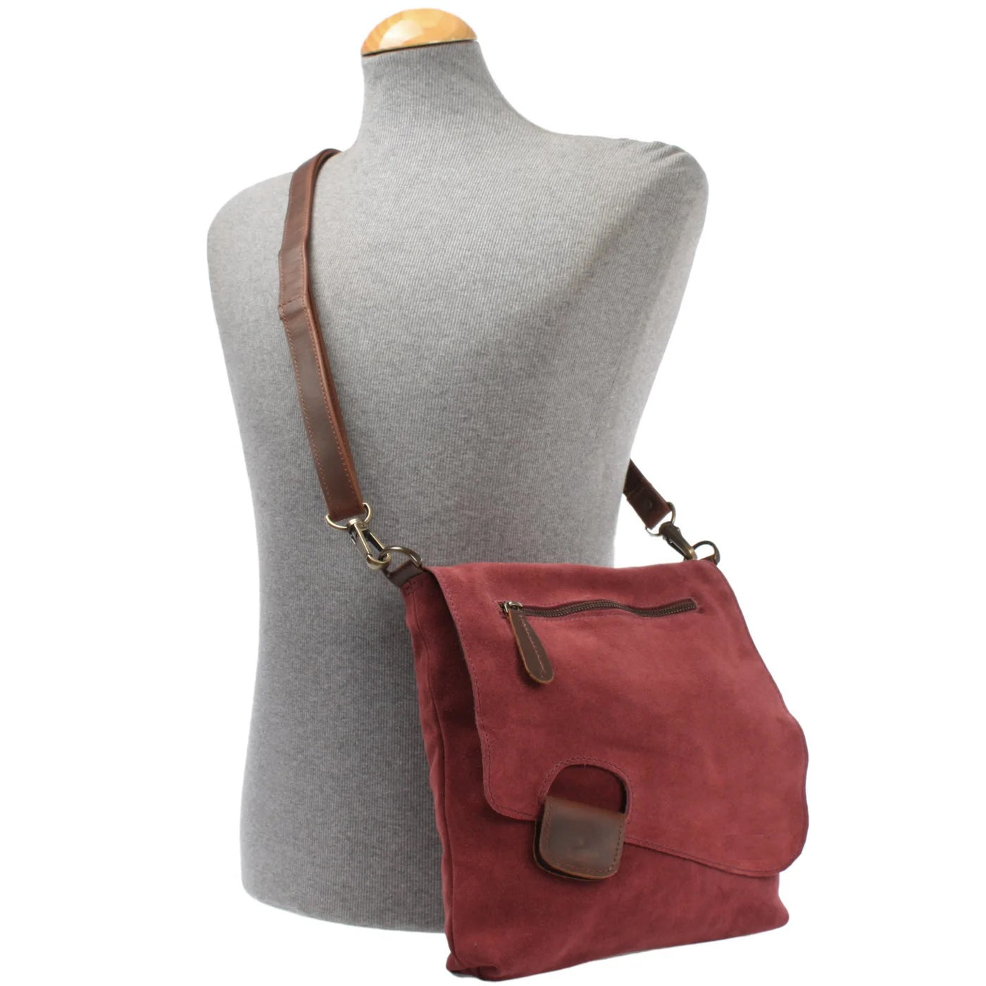Burgundy Mira suede and leather bag worn crossbody on a mannequin, showing size and adjustable strap
