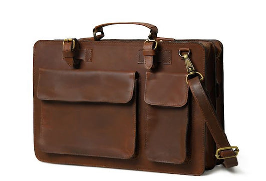 Dark brown Sable leather work briefcase, front view with two flap pockets, top handles, and shoulder strap