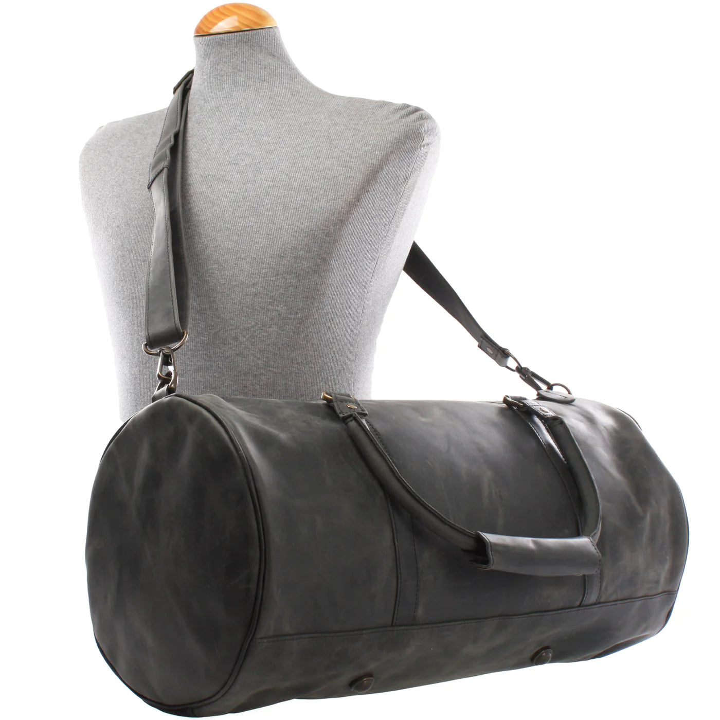 Gray Voyager leather weekender duffel displayed on a mannequin with detachable shoulder strap