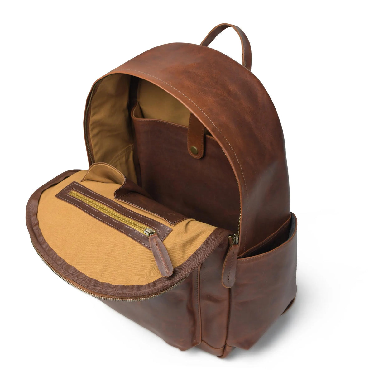 Open brown full-grain leather Cuiravo Atlas laptop backpack showing empty interior compartments